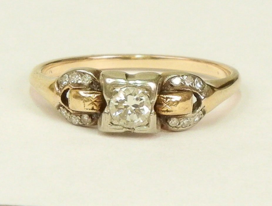 Art Deco diamond solitaire engagement ring, center: Art Deco diamond solitaire engagement ring, center round old European cut diamond measuring approximately 20 points, tw- tone white and yellow gold mounting, six 1/2 point diamonds on either side, siz