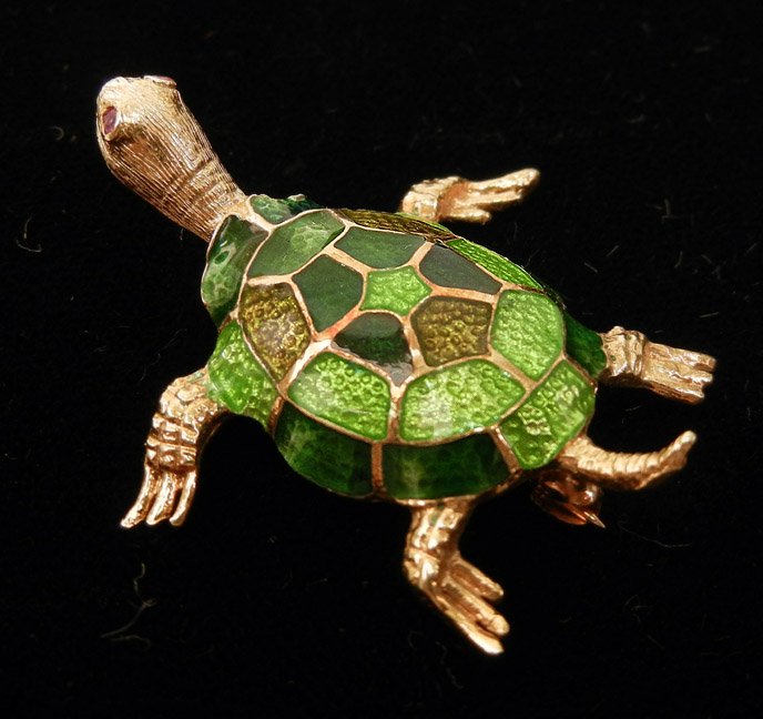 Gold enameled turtle pin, 14k yellow gold, varying: Gold enameled turtle pin, 14k yellow gold, varying shades of green enameling, ruby eyes measuring 1/2 point each, 1 3/8" long, stamped 14k, weight 6.8 grams/4.3 dwt, mid 20th C.