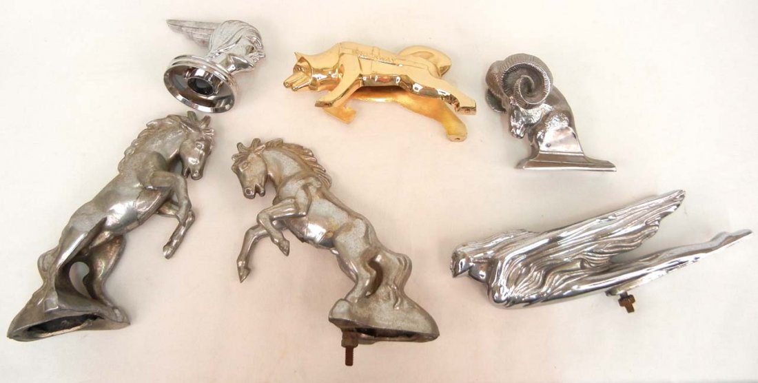 Six assorted vintage automobile hood ornaments inc: Six assorted vintage automobile hood ornaments including Brockway, Dodge Ram, Cadillac, Pontiac (plastic), and two Mustang, 9 1/2" and smaller