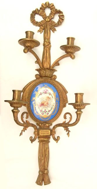 French bronze wall sconce, four arms surround cent: French bronze wall sconce, four arms surround centered French porcelain plaque, ribbon bow and tassel decoration, marked France on back, impressed 130-176, 30 1/2"
