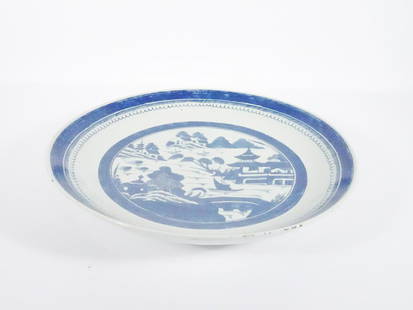 Chinese Export Canton Porcelain Charger: Chinese Export blue and white Canton porcelain charger, hand painted in blue underglaze with the classic Canton pattern of mountainous seaside landscape with pagodas, circa 19th c. Qing Dynasty period