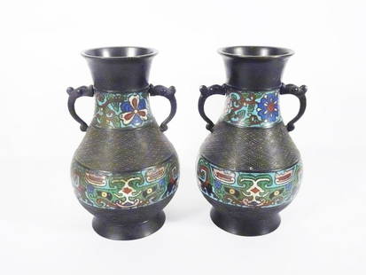 Pair of Japanese Champleve Vases: Pair of Japanese Champleve vases, decorated with geometric designs, both have double handles, circa early 20th c. Taisho/Early Showa period, both are signed on underside of base "Made in Japan", 10"