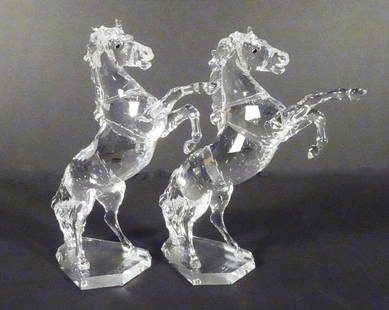 Swarovski Austrian Crystal Stallions: Pair of Swarovski Austrian crystal Rearing White Stallion Horse figures, from the Horses on Parade collection, designed by Martin Zendron, circa 1993-2005, both are signed with the Swarovski swan logo