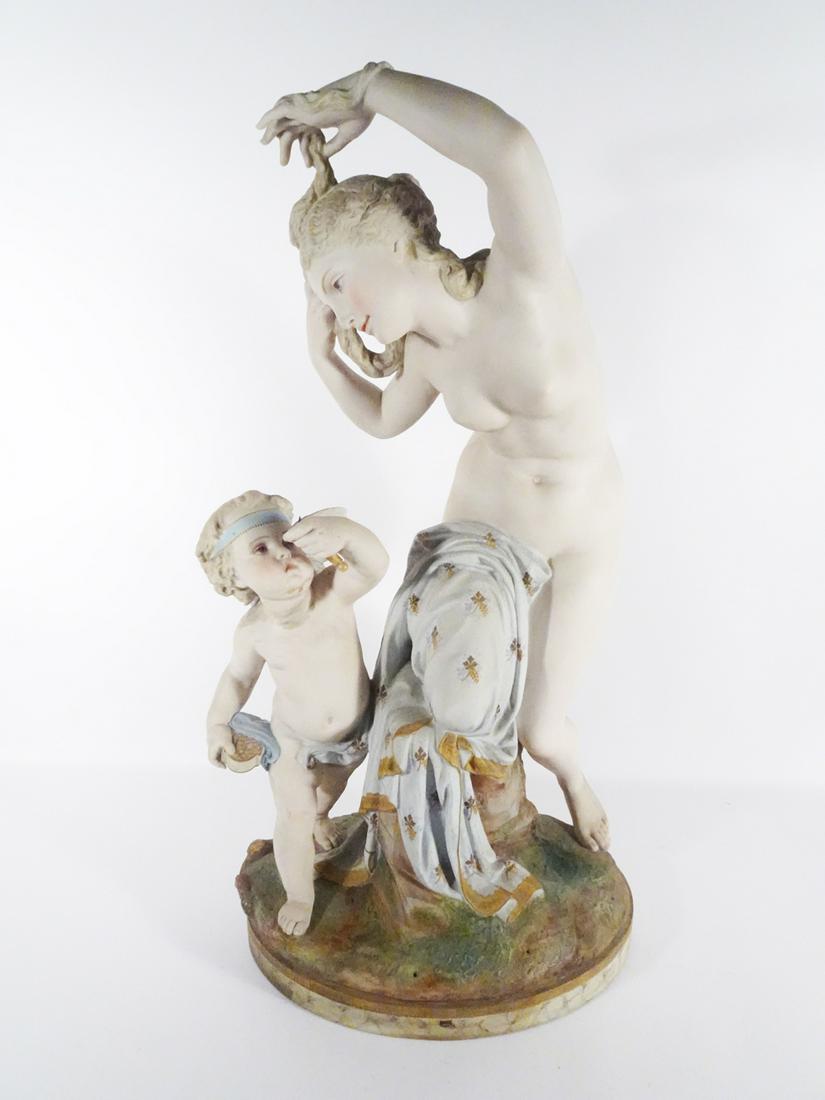 Vion and Baury French Bisque Porcelain Figurine: Vion and Baury French bisque porcelain figurine, depicts a nude female an Putti standing on a rock formation base, circa mid 19th c., signed on underside of base with green Anchor mark, 27" (h) x 14"