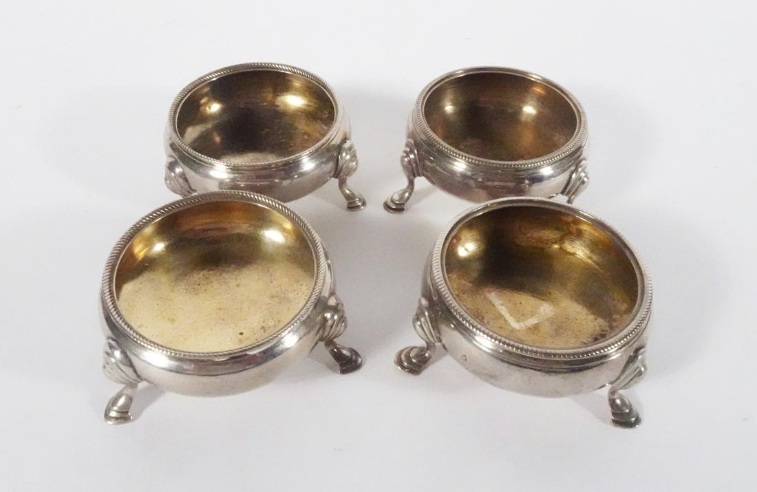 George III English Sterling Silver Salts: Set of four George III period English sterling silver salts, gold wash interiors, each is signed on underside of base with 1765 London hallmarks, 1 1/2" (h) x 2 1/2", 5.760 ozt.
