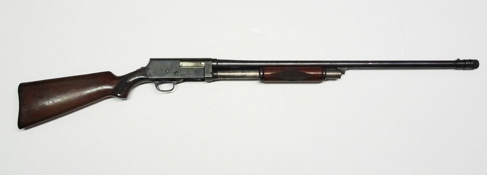 JC Higgins pump shotgun: JC Higgins pump shotgun. 12 gauge, 5 rounds, tube fed. 2 3/4" chamber. Serial number 33856. 30" barrel, length overall 49". Poly-Choke adjustable choke installed.