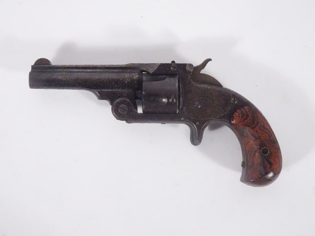 Smith & Wesson revolver: Smith & Wesson top-break double action revolver. 32 caliber. 5 round cylinder. Serial number 71393. 3" barrel. Overall length 7". Patent date 7/25/1873. C&R - YES / Instacheck - YES.