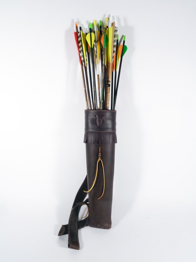 Black Widow shoulder leather quiver with arrows: Black Widow shoulder leather quiver with shoulder strap. Includes 15 29" assorted arrows. 18 1/2" length X 4 1/4" diameter.
