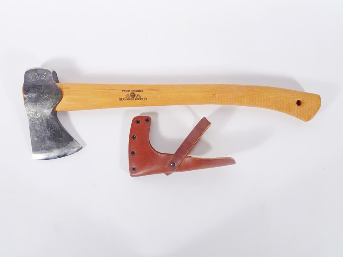 Gransfor Bruks hatchet: Gransfor Bruks hatchet. 3" face. 13 1/2" oiled hickory handle. Made in Sweden. Hatchet is marked with initials of smith who forged it. Includes leather sheath.