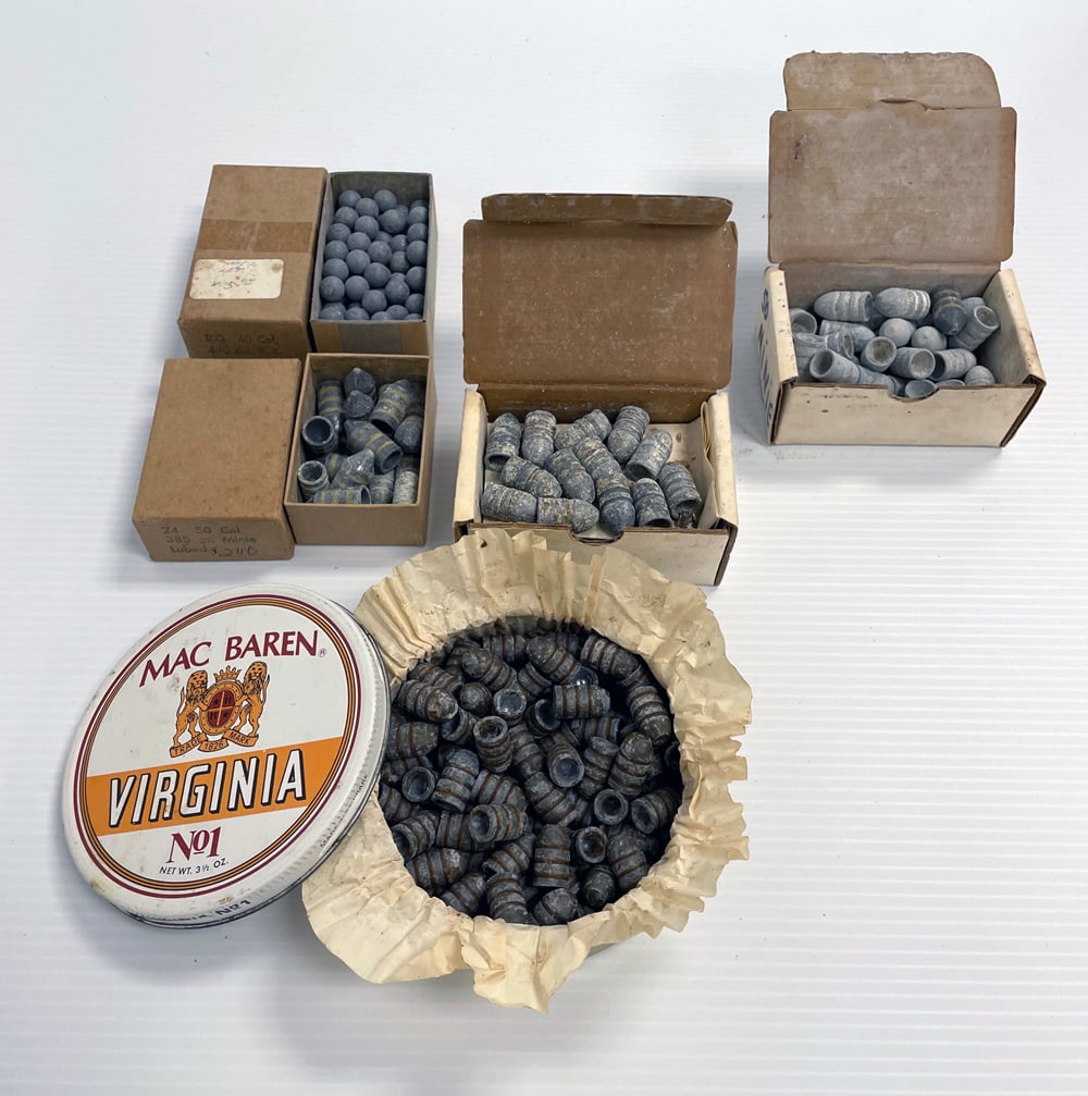 Lot of black powder projectiles: Lot of black powder projectiles. One box of twenty-four 50 caliber 385 grain, one box 45 caliber 440 diameter, two boxes 50 cal., and filled tobacco tin.