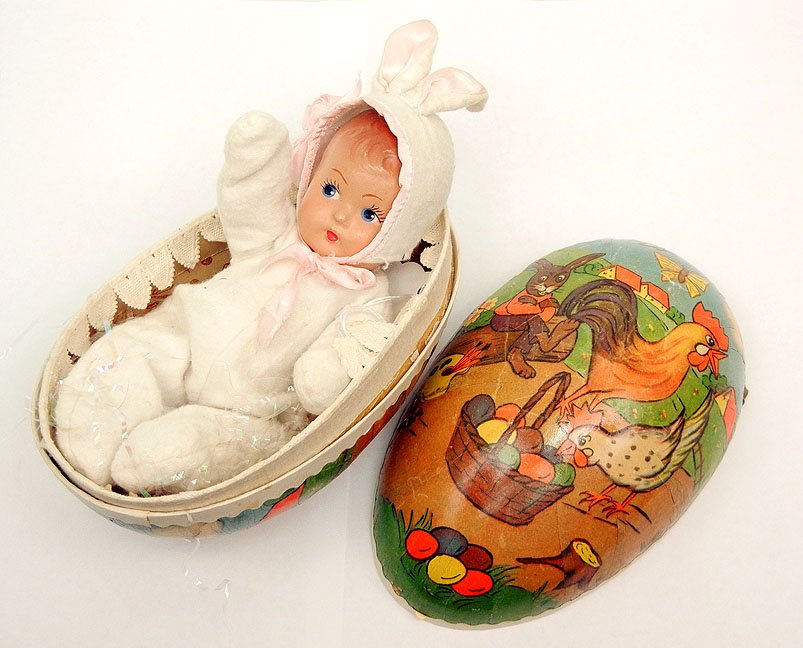 Composition Dionne Quintuplet wearing a bunny suit : Composition Dionne Quintuplet wearing a bunny suit in a German papier mache egg, unmarked