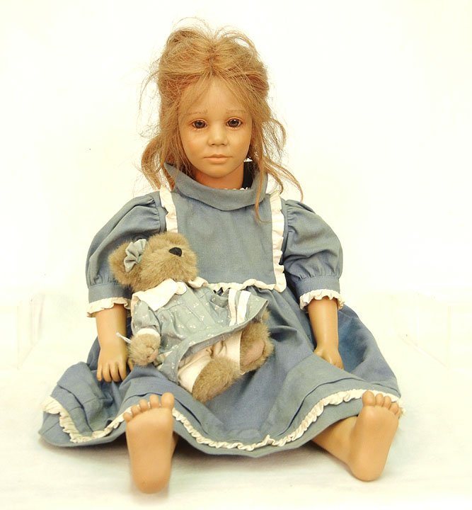 Annette Himstedt doll "Toni" with teddy bear, brown: Annette Himstedt doll "Toni" with teddy bear, brown eyes, applied lashes, closed mouth, signed on back of head, wearing tagged outfit, 23"