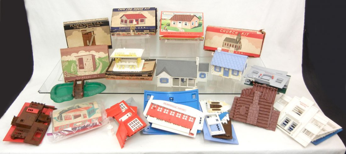 Large grouping of Plasticville kits, some boxed, i: Large grouping of Plasticville kits, some boxed, including four cape cod houses, hospital, fire department, airport, switch tower, outhouses, frosty bar, police department, freight station with platfo