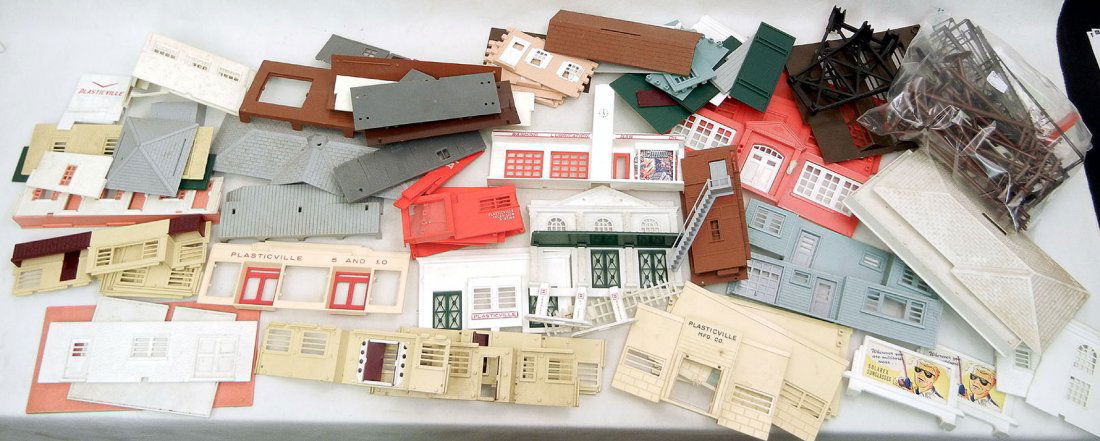 One lot of Plasticville buildings, including Plast: One lot of Plasticville buildings, including Plasticville school, television station, cape cod house, telephone poles, and more
