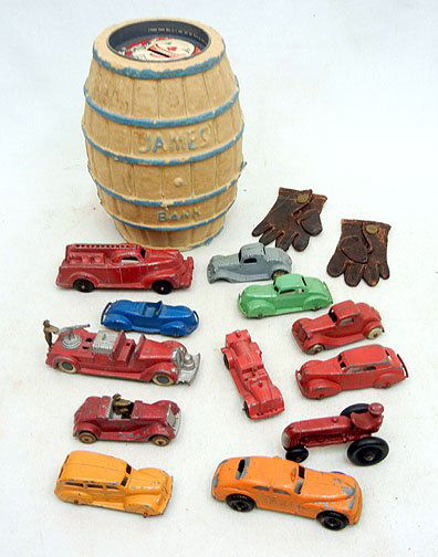 Grouping of die cast Tootsietoy cars, Manoil: Grouping of die cast Tootsietoy cars, Manoil car, and some unmarked, also a James bank barrel, leather doll gloves, and more