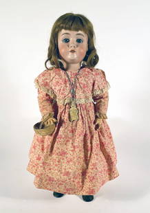 German Creidlitz Porzellanfabrik bisque head doll: German Creidlitz Porzellanfabrik doll mark Germany C.P. 1100 3, 20", composition body, with ball jointed limbs, blue sleep eyes, painted lashes, open mouth with teeth, brown wig, wearing printed pink