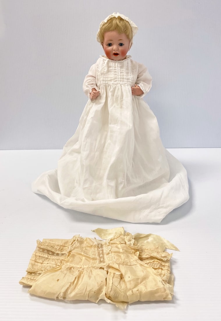 Kestner German bisque head doll: Kestner German bisque doll, character baby Sammy marked J.D.K. 211 Made in Germany, with blue sleep eyes and open mouth with lower teeth 10", five piece jointed body, in christening dress with underga