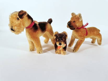 Three Steiff dogs: Three Steiff dogs, 7" high Airdale with partial chest label; 7" high Boxer, missing ear button and collar, and 4" high Lumpi with chest tag, button on ear