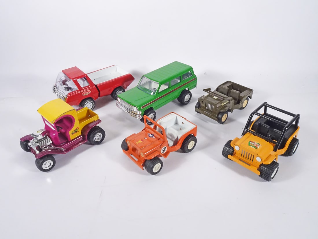 Nylint and Structo Pressed Metal Vehicles: Three piece Nylint and Structo pressed metal vehicles grouping, Nylint Corporation A-1 Towing Dual Boom Tow Truck and Model T Roadster Hot Rod and Structo Hydraulic Dumper Dump Truck, circa 1960's
