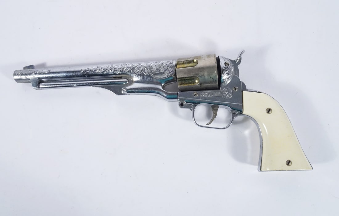 Hubley Texan Colt 45 Cap Gun: Hubley Manufacturing Co. Texan Colt 45 cap gun, nickel finish, gold accent on cylinder, original plastic grips, circa 1950's