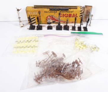 Assorted HO Scale Train Accessories Grouping: One hundred and thirteen piece assorted HO scale train accessories grouping, A.C. Gilbert Co. Block Signal, BB Plastics Telephone Poles (qty 32), Japan silver metal Railroad Signals (qty 3), Sakai Jap