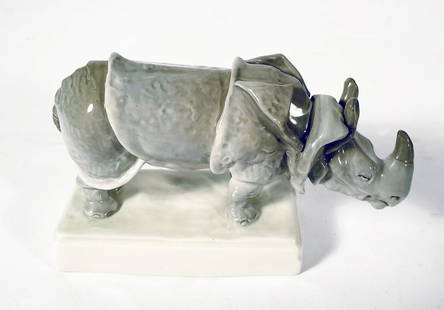 Czechoslovakian Porcelain Rhinoceros Figurine: Czechoslovakian porcelain Rhinoceros figurine, circa early 20th c., signed on underside of base "Made in Czechoslovakia Amphora" and with incised marks "O 8196 27", 4" (h) x 7" x 2 1/2"