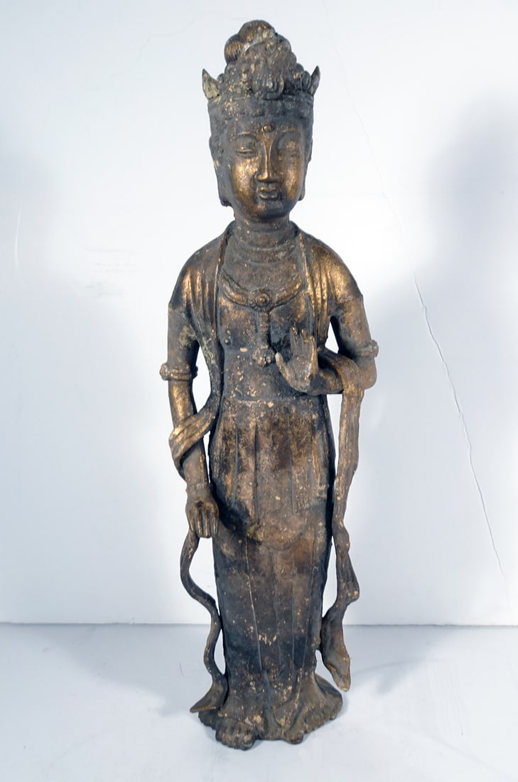Chinese Gilt Iron Guanyin Sculpture: Chinese gilt iron Guanyin sculpture, standing with left hand in mudra and robes flowing down pooling at her bare feet, circa mid 19th c. to early 20th c. Qing Dynasty period, 20 1/2" (h) x 6" x 3 1/2"