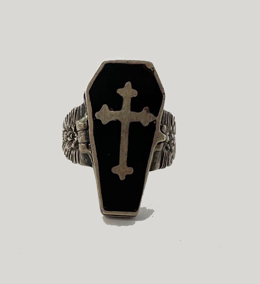 Sterling Casket Poison Ring: Sterling casket poison ring; Weight: 11.1gr; Unstamped; inside hinged casket lid of black enamel and cross reveals a skeleton.