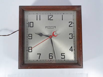 Ingraham Synchronous Motorized Wall Clock: E. Ingraham Company Synchronous wall clock, self starting motorized model H153 wall hanging clock, wood cased, silvered metal face with Arabic numerals, circa early 20th c. to mid 20th c., 15" (h) x 1