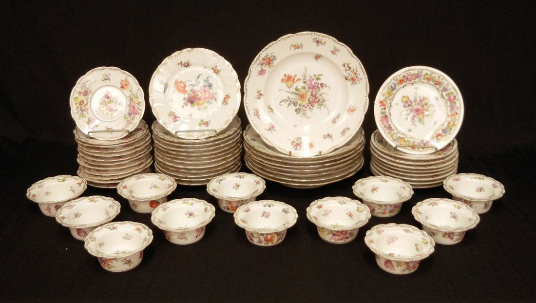 Partial Dresden dinnerware set, floral and gilt dec: Partial Dresden dinnerware set, floral and gilt decoration, marked on bottoms, eight soup bowls, 8 1/4" diameter, twelve dessert plates, 6 1/4" diameter, twelve ramekins, 3 3/4" diameter, and twelve u