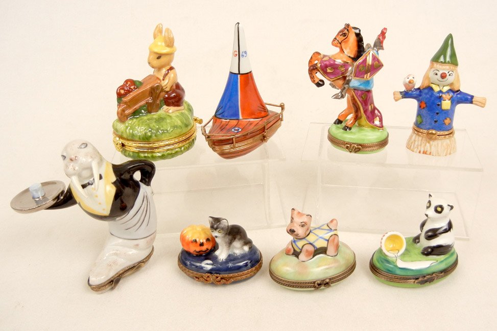 Eight Limoges porcelain pill boxes including walrus: Eight Limoges porcelain pill boxes including walrus waiter, knight on horseback, scarecrow, Halloween cat and pumpkin, sailboat, dog and panda, all signed Limoges France Peint Main on bottom, and a ra