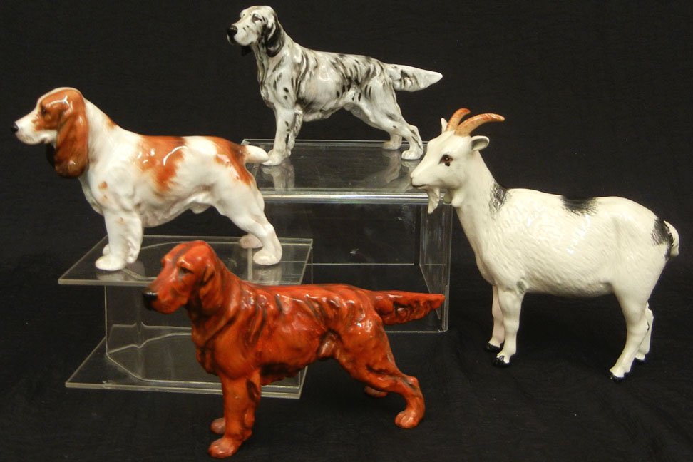 Three Royal Doulton dog figurines and one Royal Dou: Three Royal Doulton dog figurines and one Royal Doulton goat figurine, including HN 1037 Spaniel, HN 1051 English Setter, HN 1056 Irish Setter, and a goat, all marked on bottom, tallest measures 5 1/4