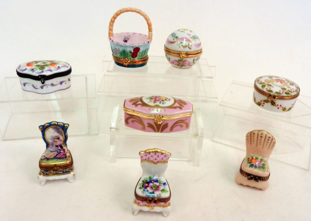 Eight Limoges porcelain pill boxes, including three: Eight Limoges porcelain pill boxes, including three chairs, basket, egg, one with strawberry decoration, and two with floral decoration, 2 3/4" and smaller