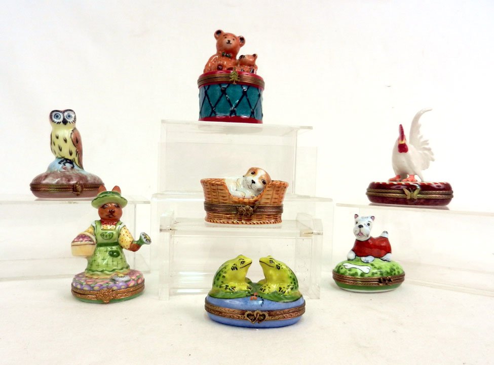 Seven Limoges porcelain pill boxes, including two b: Seven Limoges porcelain pill boxes, including two bears on drum, dog in basket, dog, rooster, rabbit, two frogs, and owl, all marked Limoges, 3 1/2" and smaller