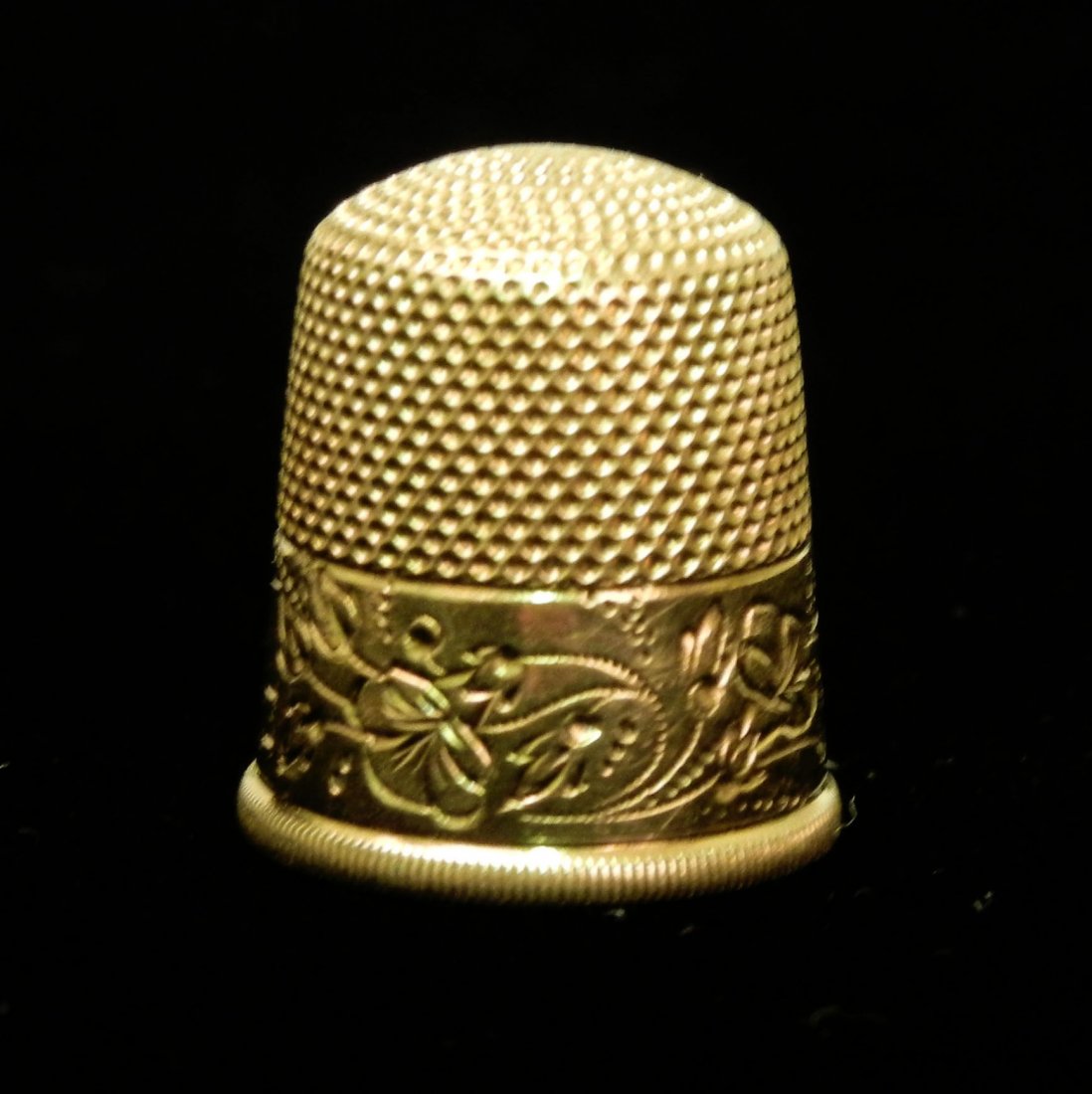 Gold thimble, 14K gold, engraved border with name : Gold thimble, 14K gold, engraved border with name "Emilie", 3/4" high, 5/8" inside diameter, size 11, marked 14K, weight 4.2 grams/2.7 dwt, early 20th C.