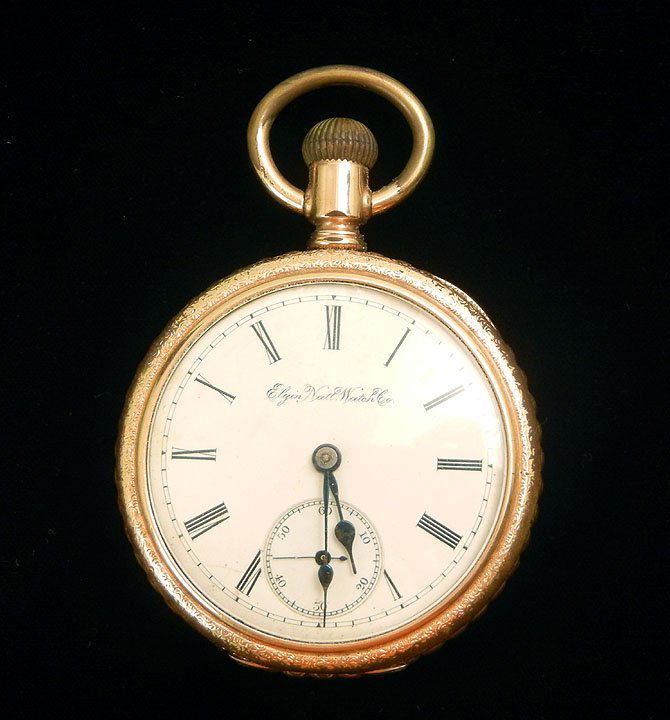 Elgin pocket watch, open face gold filled case wit: Elgin pocket watch, open face gold filled case with engraved back, Roman numeral dial, 2 1/8" diameter, number 4107461, Elgin Nat'l Watch Co., early 20th C.