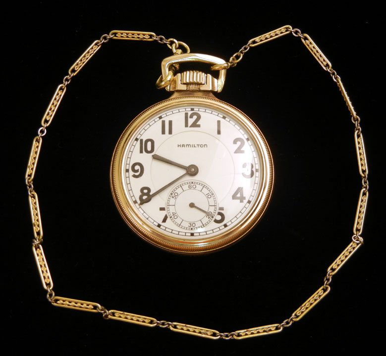 Hamilton railroad pocket watch, 2" diameter, 10K g: Hamilton railroad pocket watch, 2" diameter, 10K gold filled case marked railroad model 1144016, 25 jewel movement number 263188, 14 1/2" gold filled chain, early 20th C.