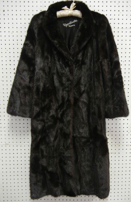 Full length black mink coat, 47" long from collar: Full length black mink coat, 47" long from collar to hem, 23" long sleeve, size large, Ulysses Furs Ltd., Toronto; and black mink hat from The Hudson's Bay Co., 21" circumference, mid 20th C.