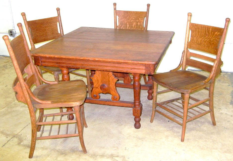 Five piece oak dining room set including table and: Five piece oak dining room set including table and four chairs, four leaves, ca.1900, table measures 29" high x 42" square, 12 1/4" leaves, chairs 38" high