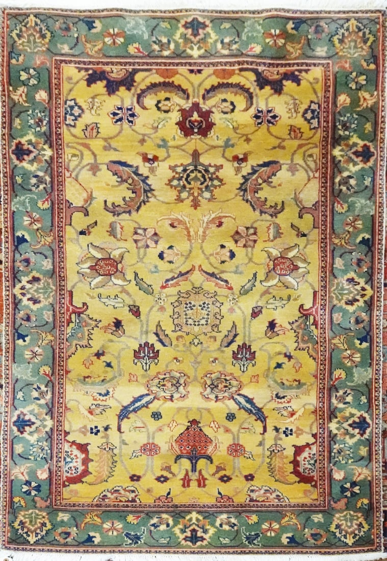 Hand Tied Persian Rug: Hand tied Persian rug, yellow and green field with multi color floral designs, circa mid to late 20th c., 6' x 3'