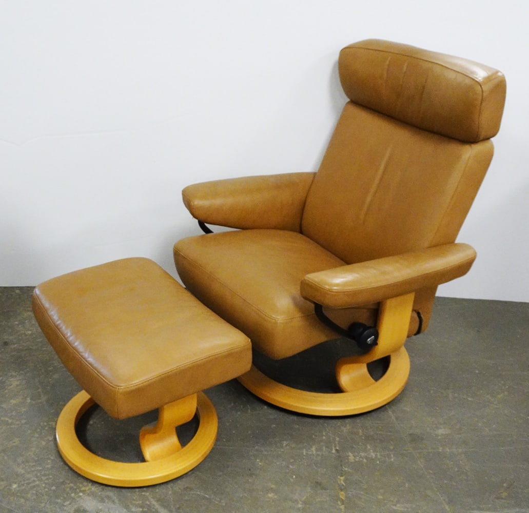 Ekornes Inc. Stressless Recliner with Ottoman: Ekornes Inc. Stressless Taurus Line recliner with ottoman, natural wood base with taupe leather, Stressless mount attached to underside, circa late 20th c., 38" (h) x 31" x 30" recliner size, 16 1/4"