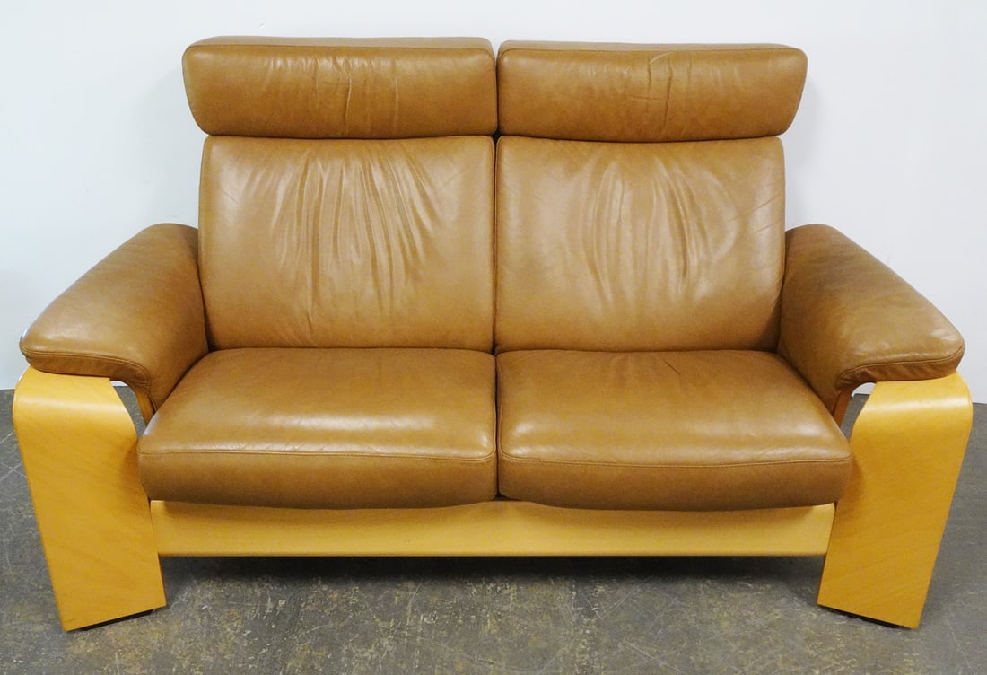 Ekornes Inc. Stressless Pegasus Loveseat: Ekornes Inc. Stressless Pegasus Line High Back two seater loveseat, natural wood frame with taupe leather, Stressless mount attached to underside, circa late 20th c., 39" (h) x 65" x 33"