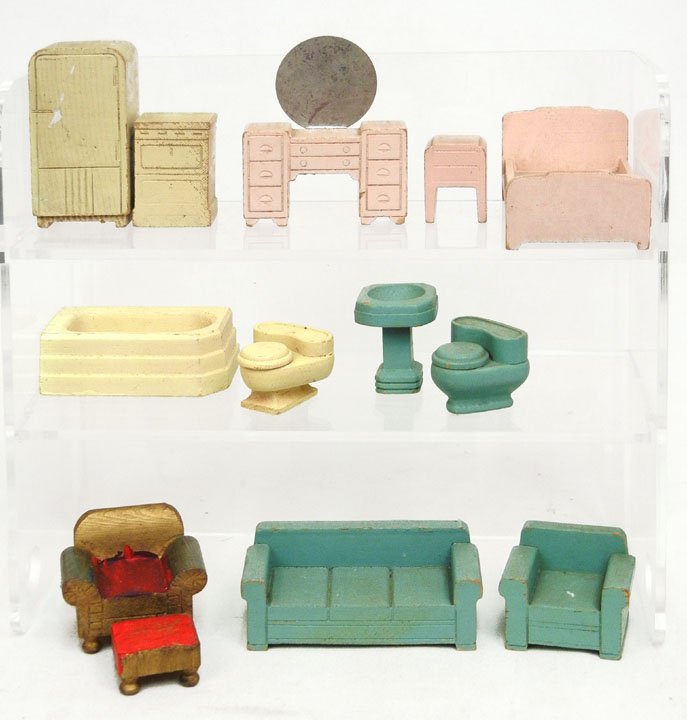 Grouping of Schoenhut doll house furniture, ca. 19: Grouping of Schoenhut doll house furniture, ca. 1920s-30s, including bed, couch, armchairs, ottoman, toilets, refrigerator, stove, tub, vanity, sink, and end table