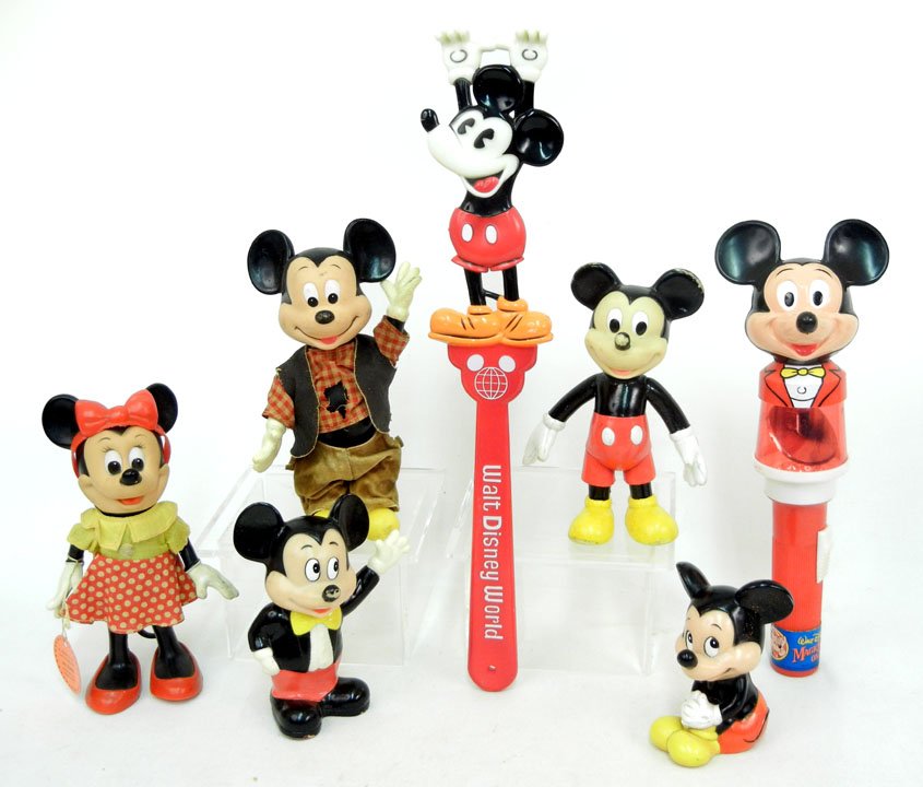 Collection of Mickey Mouse memorabilia, including: Collection of Mickey Mouse memorabilia, including back scratcher, bank, Magic Kingdom on Ice light, three additional rubber Mickeys, and one Minnie Mouse