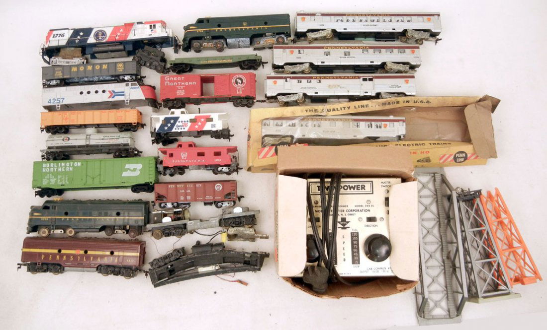Grouping of HO gauge trains, American Flyer 198 po: Grouping of HO gauge trains, American Flyer 198 power controller in original box, MRC twin power HO Train control, tracks, and accessories, including Penn Line and Mantua