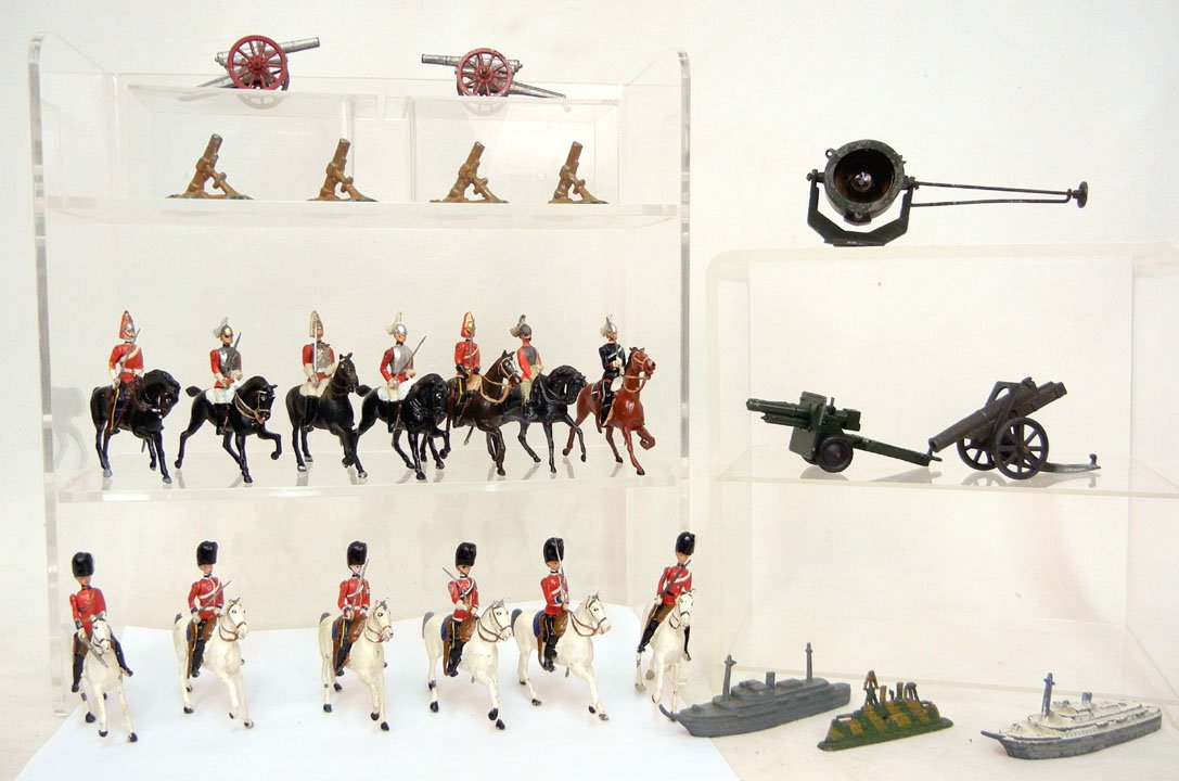 Grouping of twenty-five diecast soldiers on horseb: Grouping of twenty-five diecast soldiers on horseback, cannons, and boats, most are Britains, two boats and one cannon are Tootsie Toy