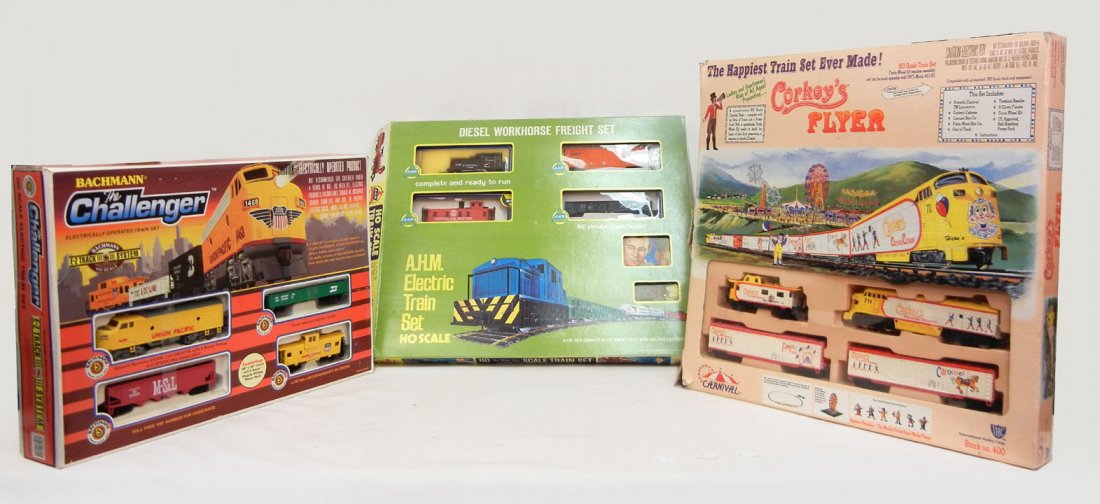 Three boxed HO scale train sets, including Bachman: Three boxed HO scale train sets, including Bachmann The Challenger, AHM Electric Train set, and Corkey's Flyer