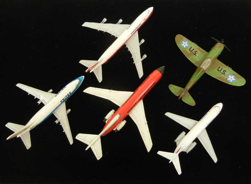 Five diecast aircrafts, including Lintoy Boeing 74: Five diecast aircrafts, including Lintoy Boeing 747, Lintoy Douglas DC-9, Aero Mini Braniff International, a camo Road Champs P-47D, and an Aero Mini United
