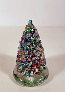 Cape Cod Glassworks Art Glass Paperweight: Cape Cod Glassworks art glass paperweight, multi color Millefiori cane segment Christmas tree on a clear glass base, CCGW91 signature/date cane embedded in base, circa late 20th c., 4" (h) x 2 1/2"