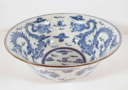 Chinese Export Blue and White Porcelain Punch Bowl: Chinese Export blue and white porcelain punch bowl, decorated with flying dragon and cloud motifs, unsigned, circa 19th c. Qing Dynasty, 6 1/2" (h) x 14 1/2"